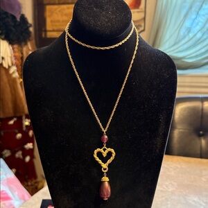 Vintage Avon, gold tone rope chain necklace with purple, resin beads, and heart